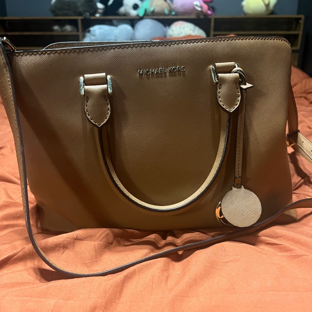 Michael Kors Authentic purse. Has a long strap for crossbody.